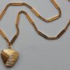 gold chain and heart pendant