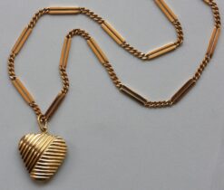 gold chain and heart pendant