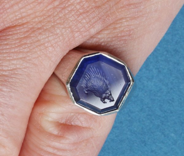 platinum and sapphire ring with an intaglio of a porcupine