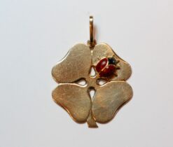 gold clover with a ladybird