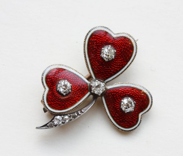 red enamel and diamond cloaver brooch