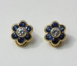 diamond and sapphire flower ear clips