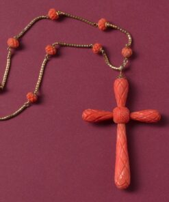 coral cross pendant