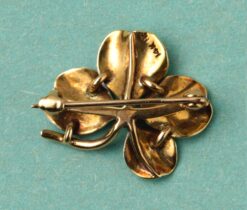 white flower brooch
