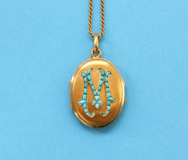gold locket with turquoise