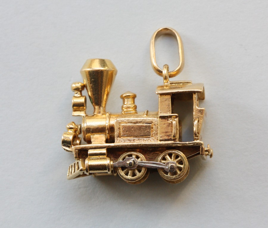 gold locomotive charm - Inez Stodel