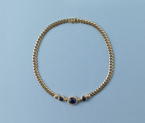 gold gourmette chain with diamond and sapphire