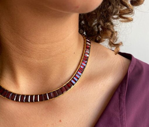 gold Poiray necklace with garnets