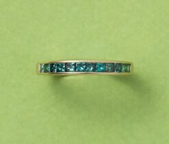gold ring with blue diamonds