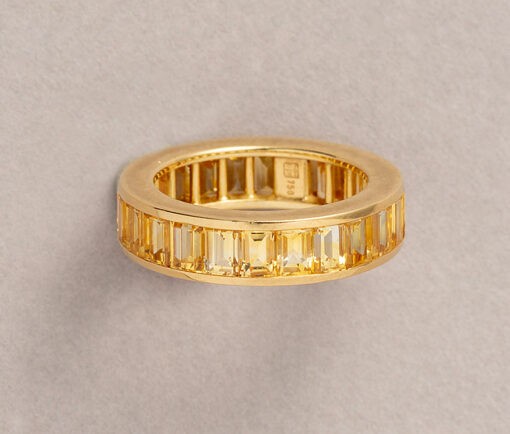 gold and yellow sapphire eternity band by hemmerle