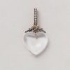 an antique rock crystal heart shaped pendant with silver and gold set with diamond