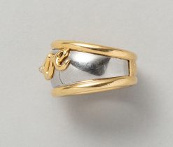 An 18-karat yellow gold and steel band ring bearing the letters LOVE, worn signature and multi-star sign for Pery Fils, France, circa 1980. Weight: 11.7 g ring Size: 18. 25 mm / 8 1/4 US