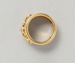 An 18-karat yellow gold and steel band ring bearing the letters LOVE, worn signature and multi-star sign for Pery Fils, France, circa 1980. Weight: 11.7 g ring Size: 18. 25 mm / 8 1/4 US