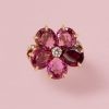 An 18-karat gold flower ring set with 5 pear cut pink and red tourmalines (app. 8.5 crt.) and in the heart of the flower a brilliant cut diamond, and in the shank a leaf shaped decoration set with diamonds, (25 diamonds app. 0.5 ct. G-I/VS-SI, signed and numbered: Bulgari, master mark: 1970AL, collection: Mediterranean Eden, circa 2020, with original case. weight: 12.75 g ring size: 17 mm / 6.5 US / 52 size: 2.2 cm