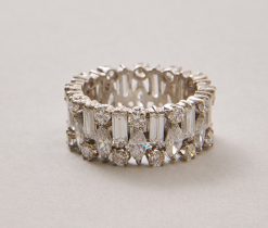 A 10 karat gold (41.8756854% / 100 * 24) white gold wide band ring - like exclamation marks - set with variously cut diamonds (12 x 0.12 ct baguette cut, 12 x 0.12 ct marquise cut, 24 x app. 0.04 ct, and a total of app. 4 ct, F-G, most likely English in origin. weight: 5.47 g ring size: fits well for a 16.25-16.75 mm width: 0.8 cm