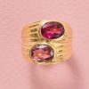 An 18k yellow gold band ring set with 2 oval faceted tourmalines (app. 1.44 ct), one light pink and one bright pink, signed Bulgari, circa 1990s.weight: 15.7 gring size: 15.5 mm / 4 3/4 US / EU 49