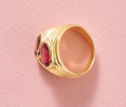 An 18k yellow gold band ring set with 2 oval faceted tourmalines (app. 1.44 ct), one light pink and one bright pink, signed Bulgari, circa 1990s. weight: 15.7 g ring size: 15.5 mm / 4 3/4 US / EU 49