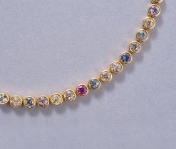 a gold and sapphire necklace