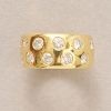 gold band ring with diamonds