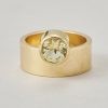 A 14-karat gold band ring with a round faceted citrine on the side, signed: Hans Appenzeller. Weight: 11.6 g Ring size: 17–17.25 mm / 6 1/2–6 3/4 US. Width: 8 mm