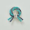 gold diamond turquoise and sapphire knot brooch